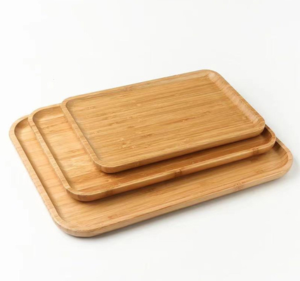 Il vassoio rettangolare di bambù rinnovabile, piatto di legno naturale dell'alimento ha sollevato la progettazione del bordo